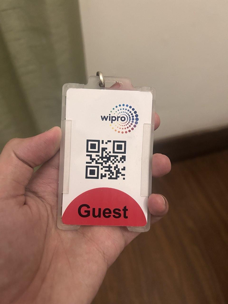 Me holding a Wipro Guest Card
